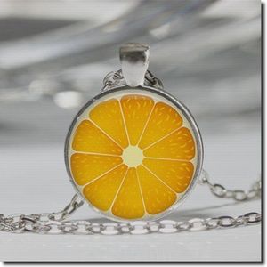 Orange Cabochon Pendant Necklace in Silver Tone .
